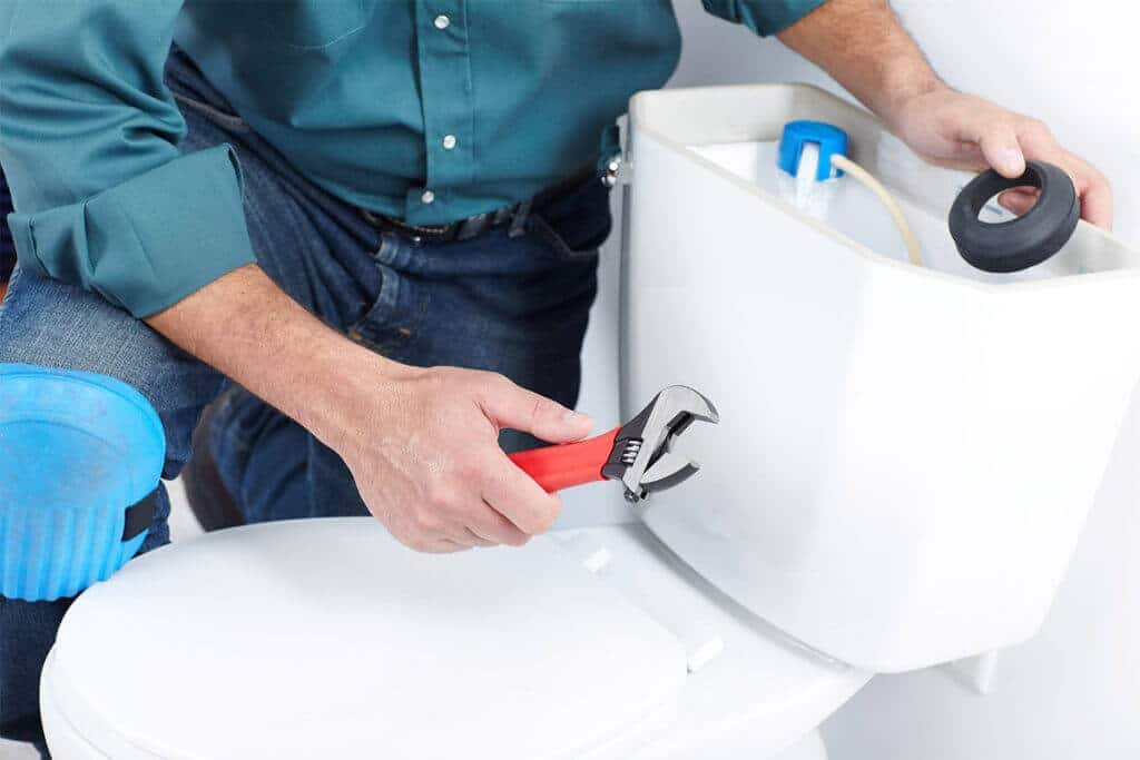 repairing a broken toilet