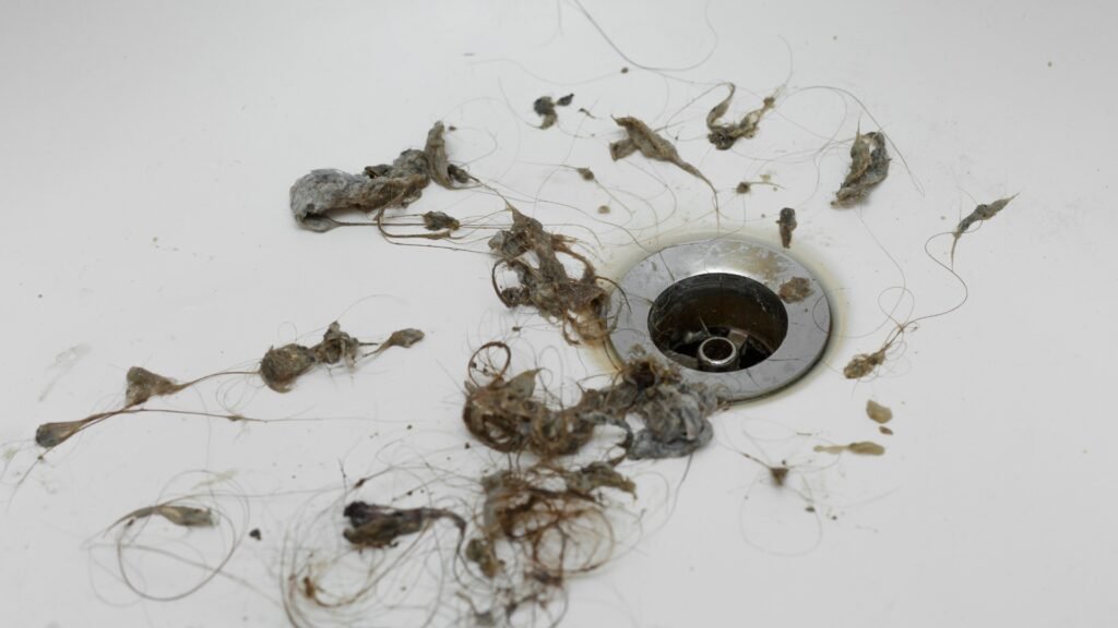 hair clogged in drain leading to blockage